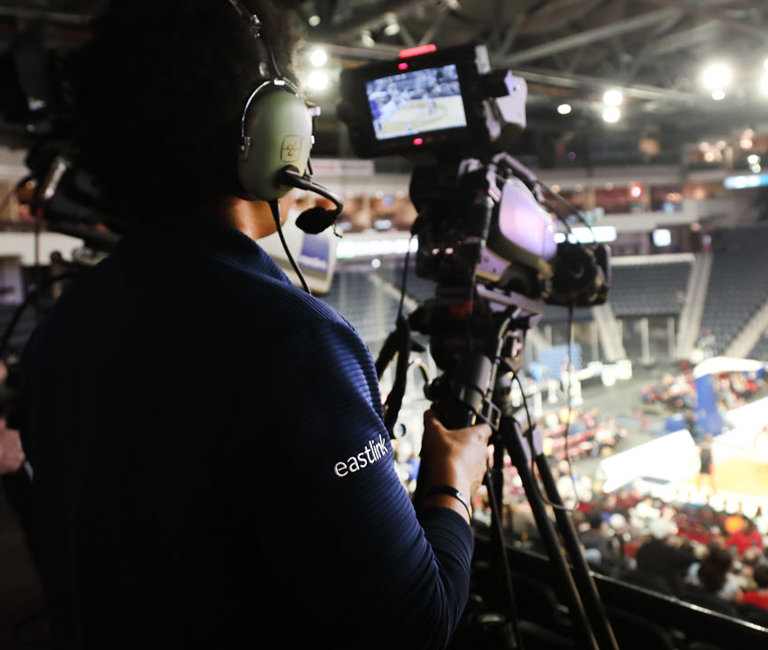 Volunteer recording a live sporting event